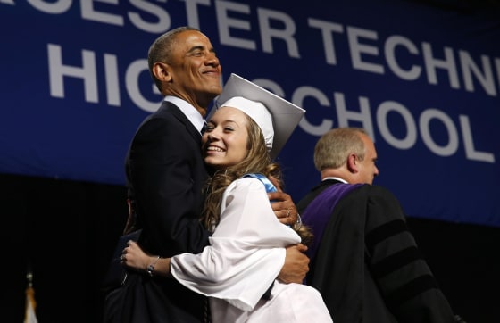 Image: U.S. President Obama receives hug from student at Worcester Technical High School graduation ceremony in Worcester