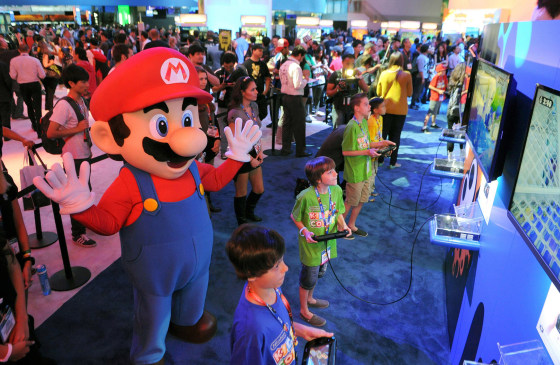LOS ANGELES, CA - JUNE 11: In this photo provided by Nintendo of America, Evan, 8,(bottom), Caleb, 11, Jonah, 12, and Noah, 13, visit Nintendo's booth during E3 on June 11, 2014 in Los Angeles, California. The children become the first kids in the world to score exclusive hands-on time with Splatoon, a new video game for the Wii U console that Nintendo announced at the trade show in Los Angeles.