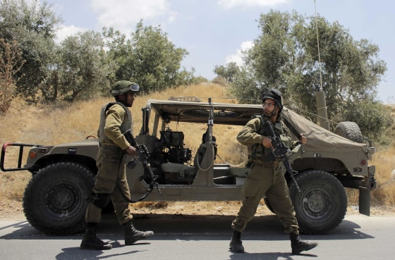 Image: Israeli soldiers patrol near the West Bank city of Hebron