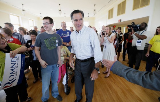 Former Republican presidential nominee Mitt Romney greets supporters before speaking at a rally for Iowa Republican Senate candidate Joni Ernst, on May 30 in Cedar Rapids, Iowa.