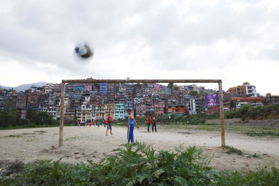 Image: Children play soccer on a playing field in Kirtipur, Kathmandu