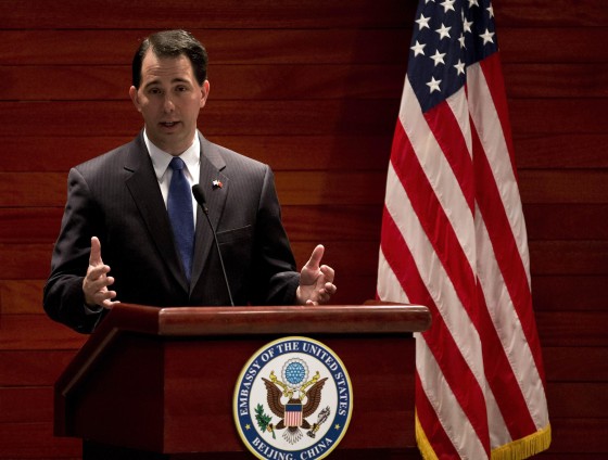 Wisconsin Governor Scott Walker speaks after witnessing a signing memorandum of understanding of the commercial deals between U.S. and China at the U.S. Embassy in Beijing in this photo from April 15, 2013. Over the past year Wisconsin's Republican Governor Scott Walker has worked his way down a checklist of items commonly associated with a run at the U.S. Presidency. REUTERS/Andy Wong/Pool (CHINA - Tags: POLITICS