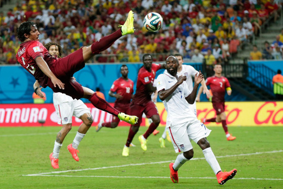 Image: Portugal's Bruno Alves kicks the ball above United States' DaMarcus Beasley