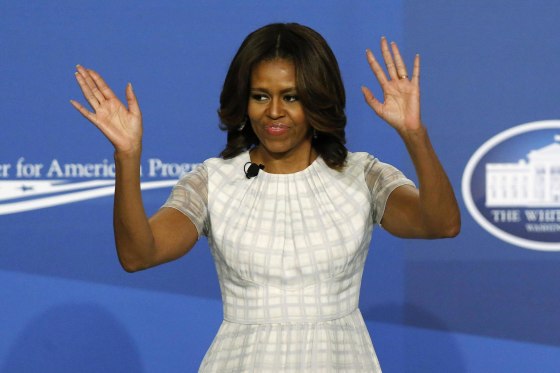 U.S. first lady Michelle Obama takes the stage to participate in the White House Summit on Working Families in Washington June 23, 2014. President Barack Obama, as part of efforts to make the U.S. workplace more accommodating for employees with families, will on Monday direct federal agencies to step up efforts to give workers more leeway in determining their schedules. REUTERS/Jonathan Ernst