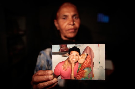 Image: Fatima Munshi holds a picture of herself with her son Saroo Brierley.
