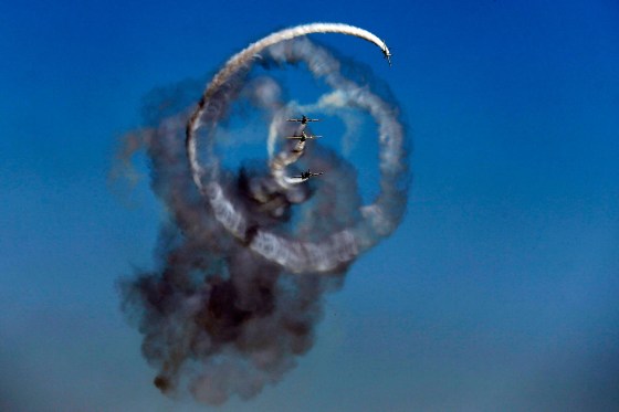 Image: Aerobatic Yakkers team perform on YAK-52 airplanes during Bucharest International Air Show at Baneasa airport, in Bucharest