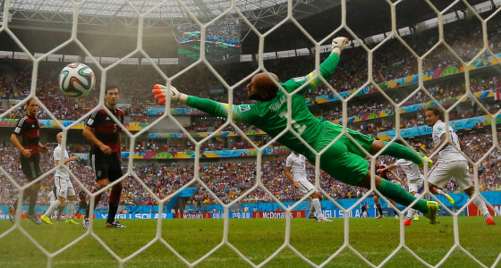 Image: Germany's Mueller scores past Howard of the U.S. during their 2014 World Cup Group G soccer match in Recife