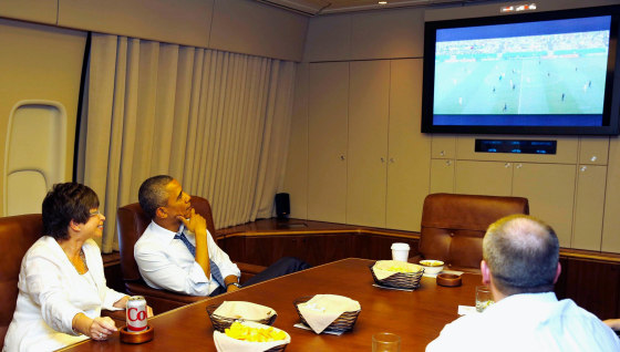 Image: U.S. President Obama and his senior advisor Jarrett watch the U.S. and Germany World Cup soccer match while aboard Air Force One