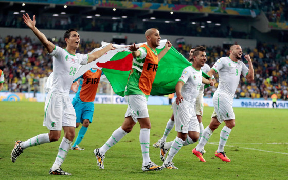 Image: Algerian players celebrate after the group H World Cup soccer match between Algeria and Russia at the Arena da Baixada in Curitiba, Brazil