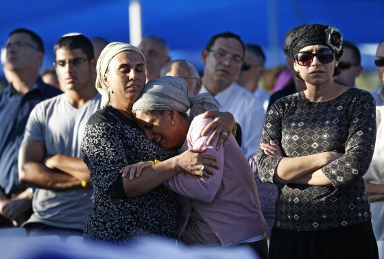 Image: Shaer and Yifrah, mothers of two of the three Israeli teens abducted and killed in the West Bank, mourn during the joint funeral of their sons in Modi'in