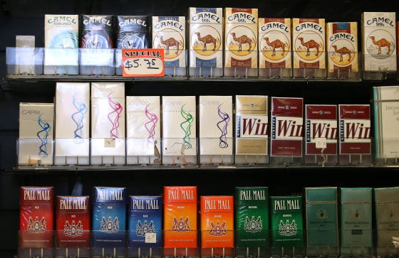 Image: Cigarette brands manufactured by Reynolds Amercian are displayed at a tobacco shop on July 11 in San Francisco, Calif.