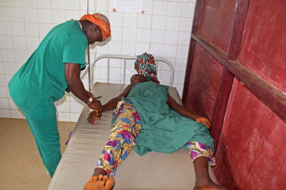 A boy is treated after he was injured in a stampede that took place the night before during a rap concert in the city of Conakry, Guinea, July 30, 2014.