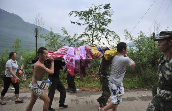 Image: Injured person is evacuated after a magnitude 6.3 earthquake hit Longtoushan town, Ludian county, Zhaotong, Yunnan province