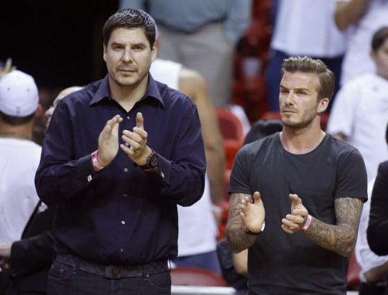 Image: File photo of former soccer player Beckham and founder of Brightstar Corp. Claure applauding before Game 5 of the NBA Eastern Conference final basketball playoff between the Indiana Pacers and the Miami Heat in Miami, Florida