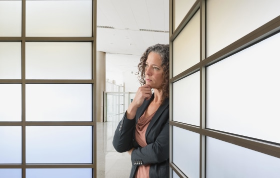 Businesswoman thinking in office.