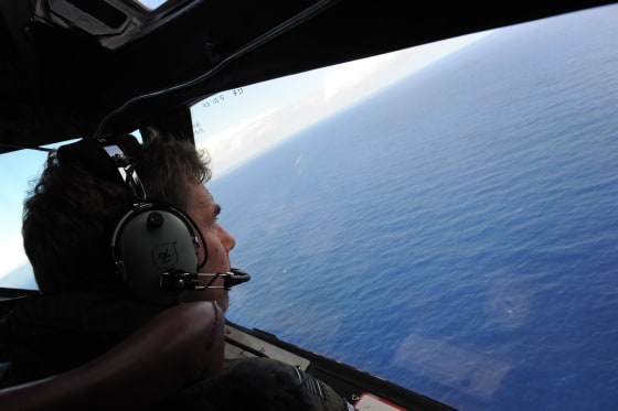 Royal New Zealand Air Force (RNZAF) P-3K2-Orion aircraft co-pilot and Squadron Leader Brett McKenzie helping to look for objects during the search for missing Malaysia Airlines flight MH370, far off the coast of Perth on April 13, 2014.