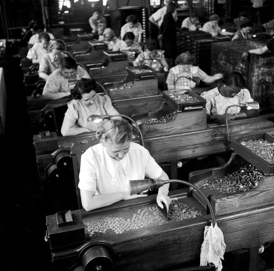 Image: Quality control inspectors in a mint in Philadelphia look out for blemished coin in 1948.