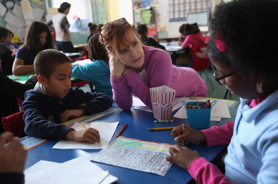 Fifth grade teacher Millie Ramirez speaks with students about Superstorm Sandy on Nov. 5, 2012 in the East Village neighborhood of New York.