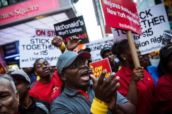 Image: Protesters demanding higher wages and unionization for fast food workers march near Times Square in New York City.