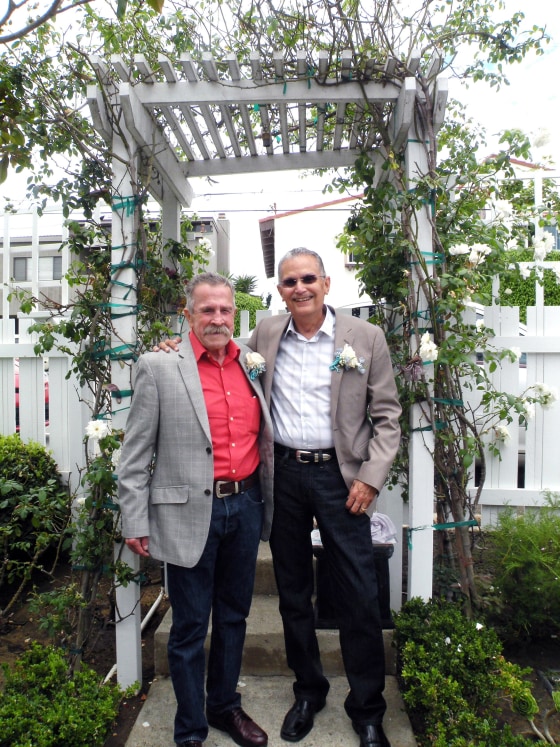 Fred McQuire, left, and George Martinez pose for photos at their wedding in California. 