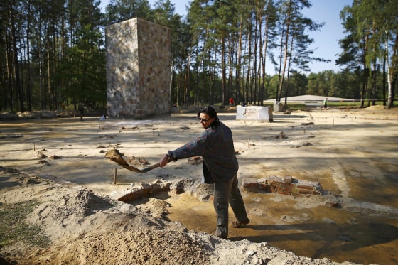 Image: Archeologist and historian Zalewska digs inside the perimeter of a Nazi death camp in Sobibor