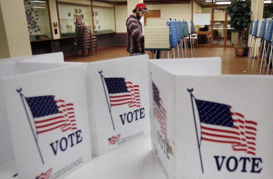 A voter casts his ballot at a polling site in the 2012 US presidential election in Cleveland, Ohio, USA, 06 November 2012.