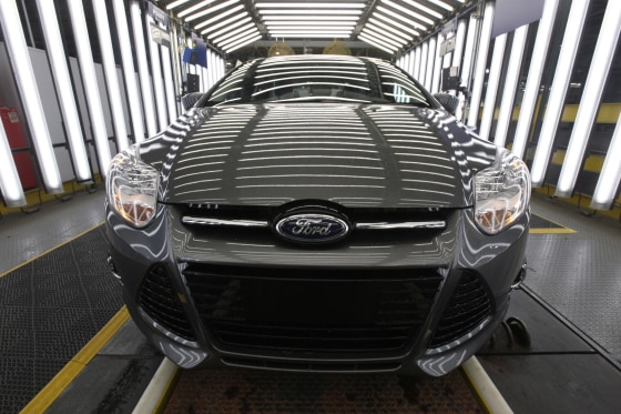 Image: A 2012 Ford Focus on the assembly line at the Ford Michigan Assembly plant