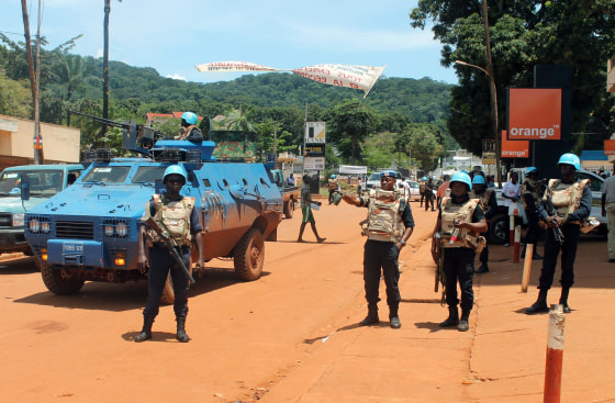 United Nations peacekeepers are seen stationed in the center of the Central African Republic capital Bangui, on October 8, 2014, following fresh violence that rocked the country leaving up to five people dead and several others wounded. The violence was sparked by an incident the day before when a motorcyclist threw grenades injuring several pedestrians in the capital, an officer from the UN peacekeeping MINUSCA force said. Further violence erupted in Bangui's KM5 district when a taxi driver was killed by Muslims who then torched several homes. Separately a group of Muslims tried to advance on the capital's northern districts but were arrested by European peacekeepers. The unrest has pitted different groups -- split along religious, ethnic and tribal lines -- against each other. 
