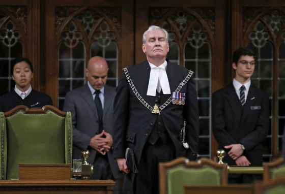 Image: Canada's Sergeant-at-Arms Kevin Vickers is applauded in the House of Commons in Ottawa