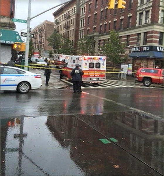 Image: An ambulance and first responders in protective gear responding to the 911 call on 147 Street and Broadway Thursday afternoon.