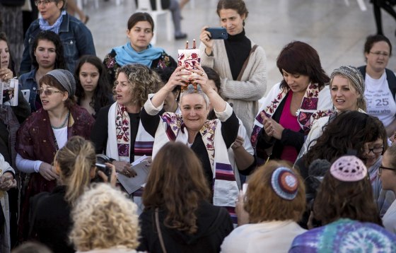 Image: Members of the group 'Women of the Wall' succeed for the first time in smuggling a Torah scroll to the Western Wall