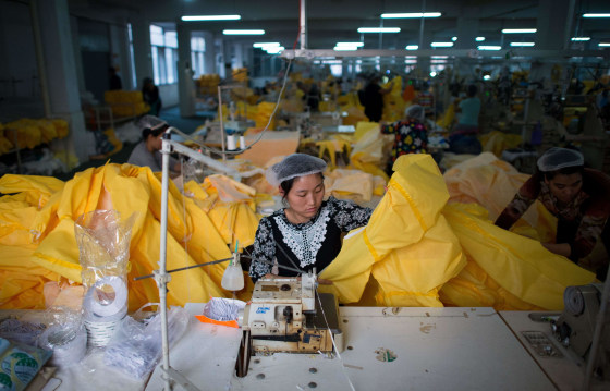 Image: Factory making protective suits for use in handling people infected with the Ebola virus