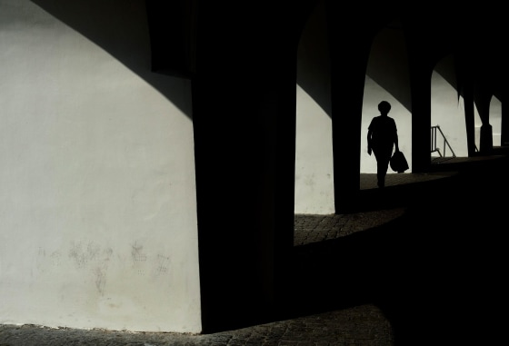 epa04402698 Pedestrians walk through a medieval arcade near Prague Old Town Square in central Prague, Czech Republic, 16 September 2014. Meteorologist predict cloudy weather with temperatures dropping to between 20 and 22 degrees Celsius within the next days. EPA/FILIP SINGER