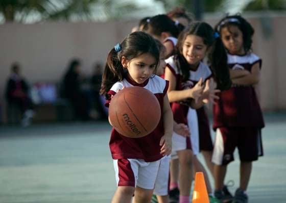 Image: Saudi and expatriate girls practice basketball at a private sports club