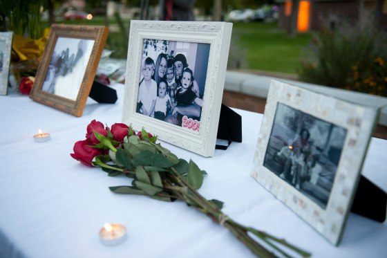 Image: Photos of the Strack family are displayed during a vigil for the family at Pioneer Park in Provo, Utah, on Oct. 2.