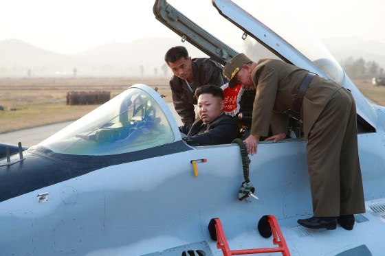 Image: North Korean leader Kim Jong Un sits in an airplane as he guides a flight drill for the inspection of airmen of the Korean People's Army Air and Anti-Air Force