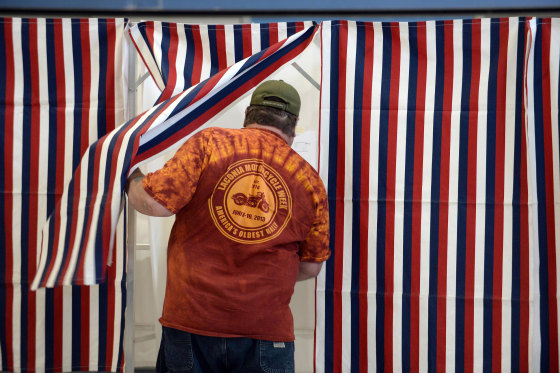 MANCHESTER, NH - NOVEMBER 4: A voter enters the voting booth at Bishop Leo E. O'Neil Youth Center November 4, 2014 in Manchester, New Hampshire. New Hampshire features a tight race between incumbent U.S. Senator Jeanne Shaheen (D-NH) and former Massachusetts U.S. Senator Scott Brown. (Photo by Darren McCollester/Getty Images)