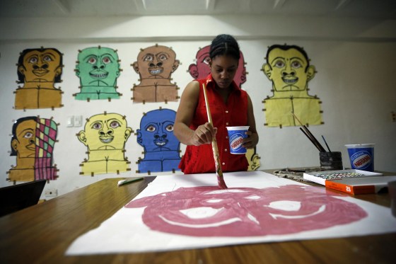 Misleidys Castillo, 29, paints at home. She has autism and is deaf. Misleidy has shown her work in París, next month in Miami and next year she will exhibit in New York
