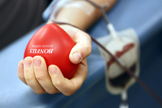 Image: Laura Jackson, 27, of Denver, Colo. squeezes a heart as she donates blood