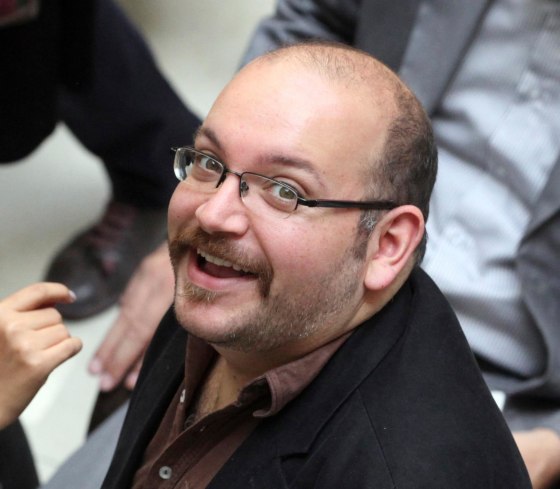 Jason Rezaian, an Iranian-American correspondent for the Washington Post smiles as he attends a presidential campaign of President Hassan Rouhani in Tehran, Iran, April 11, 2013. The family of Rezaian jailed without charge in Iran is urging authorities in Tehran to release him, calling his incarceration a “farce” 100 days after he was detained.