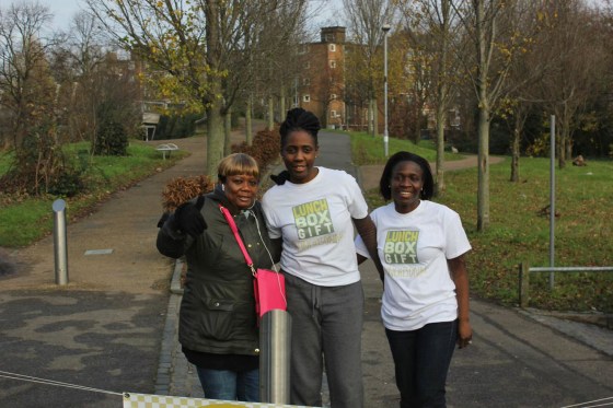 Memuna Janneh, center, stands with LunchBoxGift volunteers in London.