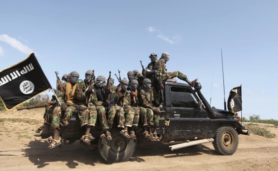 Members of al Shabaab ride in a pick-up truck outside Somalia's capital Mogadishu