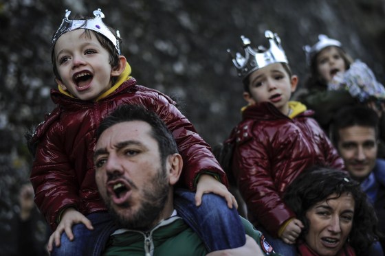 Image: People enjoy the Cabalgata Los Reyes Magos (Cavalcade of the three kings) the day before Epiphany, in Pamplona, northern Spain, Monday, Jan. 5, 2015.