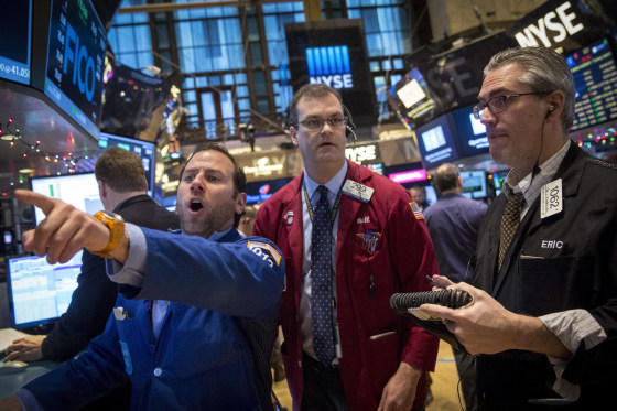 Image: Specialist trader Mike Pistillo works on the floor of the New York Stock Exchange