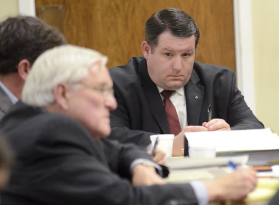 Former Eutawville Police Chief Richard Combs sits with lawyers on the second day of testimony in his trial for the murder of Bernard Bailey in Orangeburg, South Carolina January 8, 2015. Combs, 38, faces up to life in prison if convicted of killing Bernard Bailey, 54, in the town hall parking lot in Eutawville, a town of about 300 people southeast of Columbia. REUTERS/The Times and Democrat/Larry Hardy/Pool (UNITED STATES - Tags: CRIME LAW)