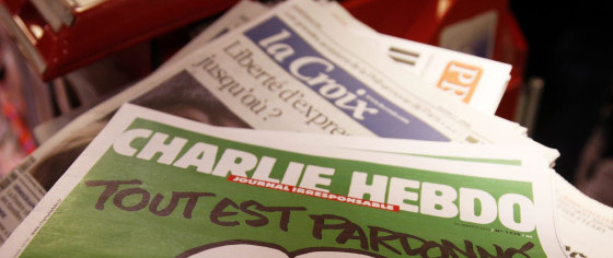 The new edition of the French satirical magazine Charlie Hebdo is on sale at Gare de Lyon train station, in Paris on Jan. 14. Asian and Muslim satirists and writers have been at the forefront of a new conversation in the wake of the attack at the magazine's office, challenging the limits of free speech.