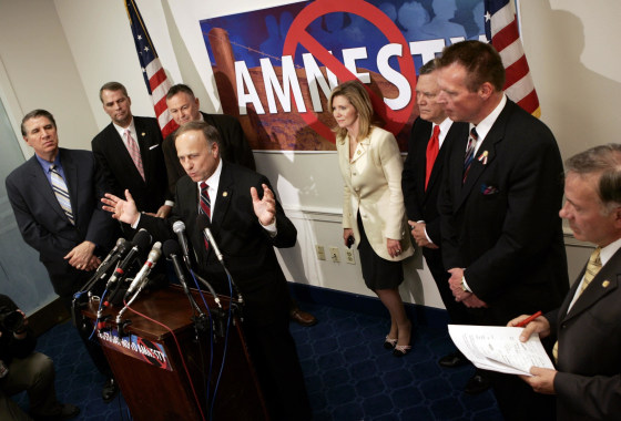 Surrounded by fellow House members, Rep. Steve King (R-IA) speaks out against any guest-worker legislation for immigrants during a news conference on Capitol Hill in Washington, in this March 30, 2006 file photo. King's high-profile role in the debate over President Barack Obama's executive order on immigration threatens Republican leaders' efforts to rebrand the party as more friendly to Hispanics, while his effort to block funding for the action raises the risk of a government shutdown. King and Representative Michele Bachmann, a fellow Tea Party activist, plan a news conference on December 3, 2014 to make their case that Obama has violated the U.S. Constitution by moving to shield 4.7 million undocumented residents from deportation if they have no serious criminal record. To match story USA-CONGRESS/SHUTDOWN-KING REUTERS/Kevin Lamarque/Files (UNITED STATES - Tags: CRIME LAW POLITICS BUSINESS EMPLOYMENT)