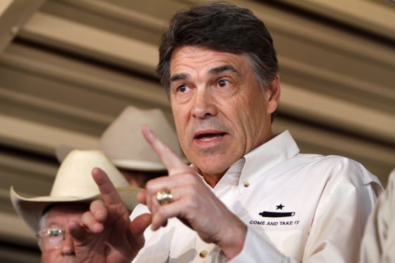 Image: File photo of Texas Governor Perry answering questions from the media after aerial tour over the fertilizer plant explosion site in West, Texas