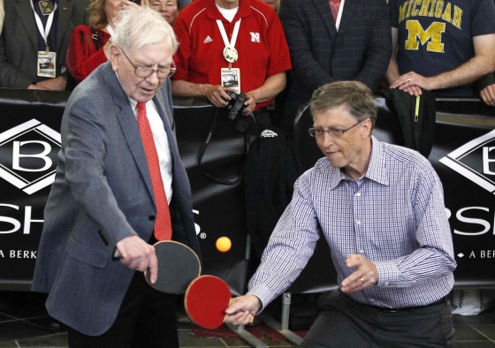 Image: Berkshire Hathaway CEO Warren Buffett plays table tennis with Microsoft Chairman Bill Gates in Omaha