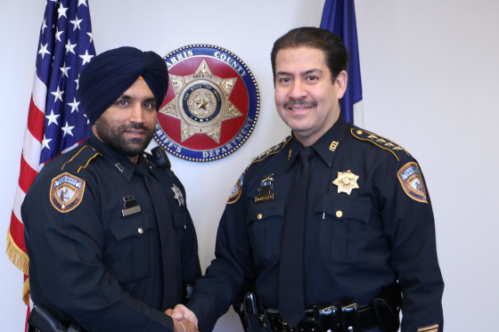 Deputy Sandeep Singh Dhaliwal with Sheriff Adrian Garcia.